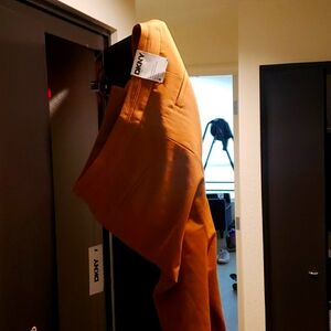 DKNY sits at natural waist. Easy through hip and thigh wide leg. Full length